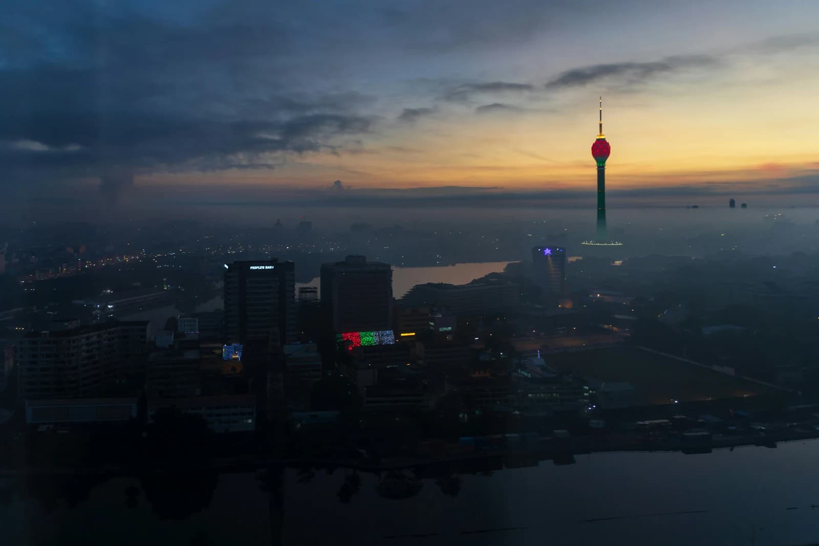 Colombo skyline and the illuminated Lotus Tower at sunset