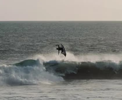 A surfer riding an ocean wave