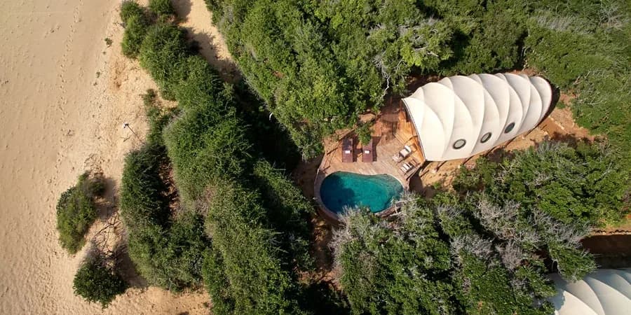 Aerial view of a Cocoon Pool Suite with its private plunge pool at Wild Coast Tented Lodge