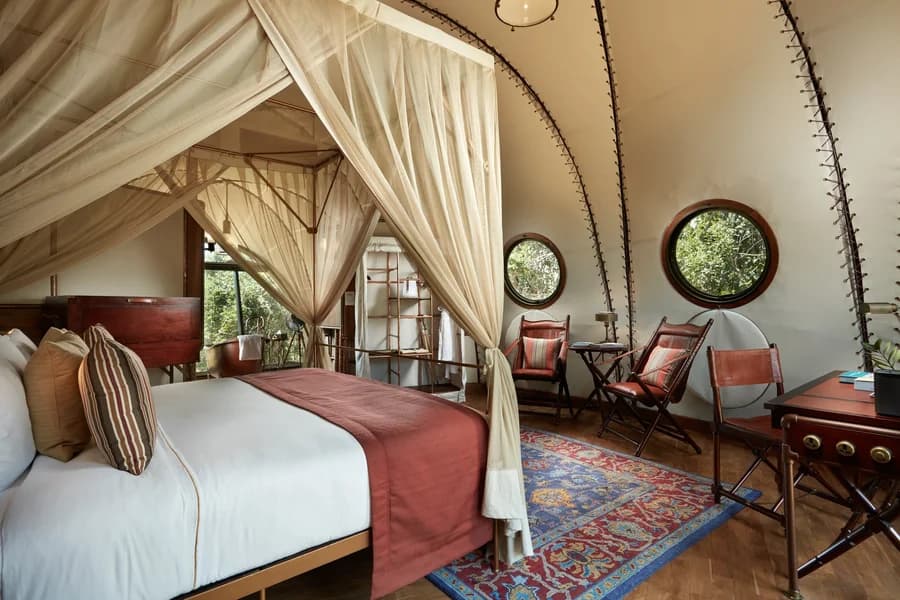 Cocoon Suite at Wild Coast Tented Lodge with a four-poster bed and vaulted canvas ceiling