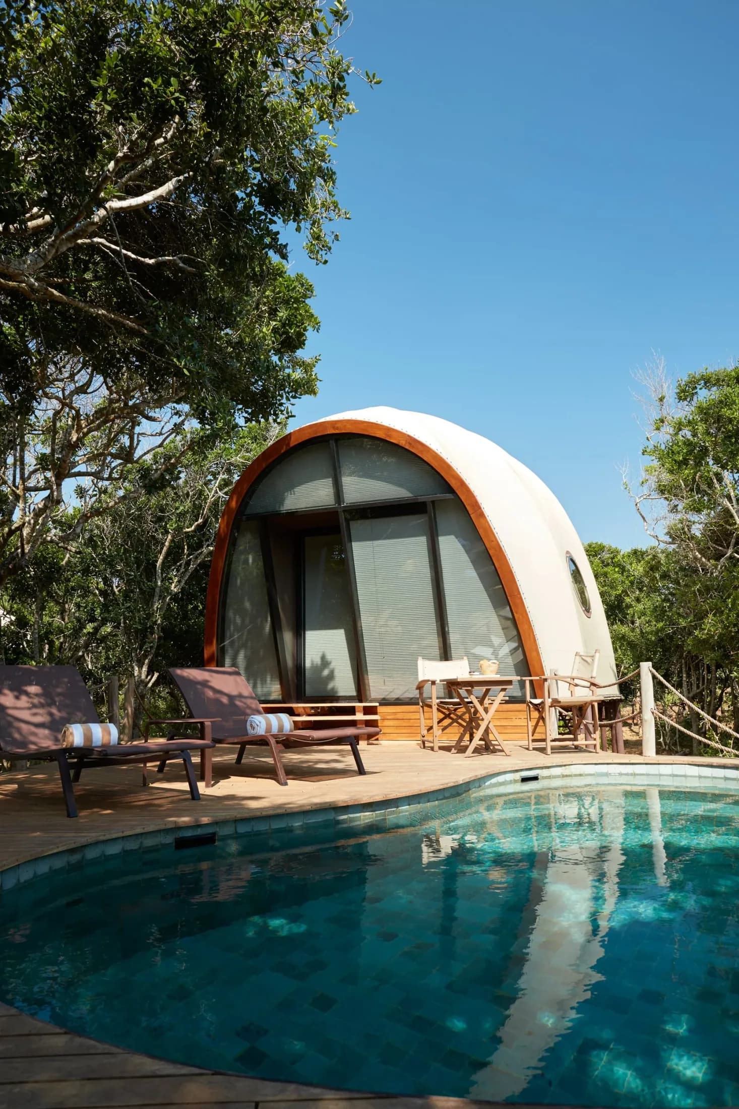 Wild Coast Tented Lodge’s cocoon-shaped tent and private pool amid coastal vegetation
