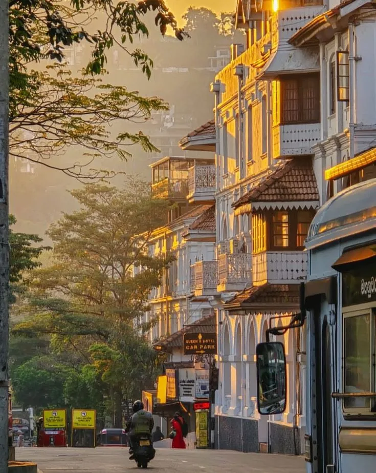 Historic buildings along a sunlit street in Galle