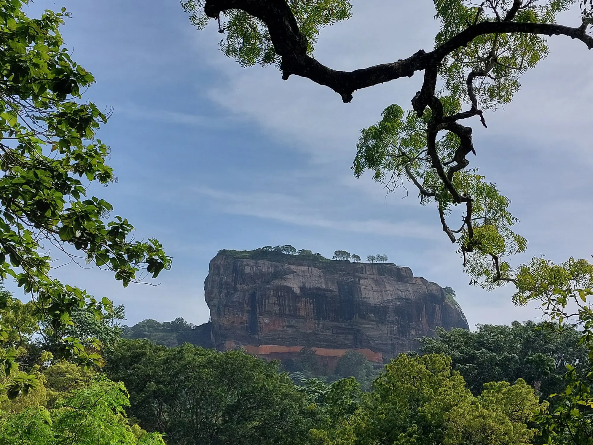 Breakfast being prepared on Pidurangala with Sigiriya in the distance