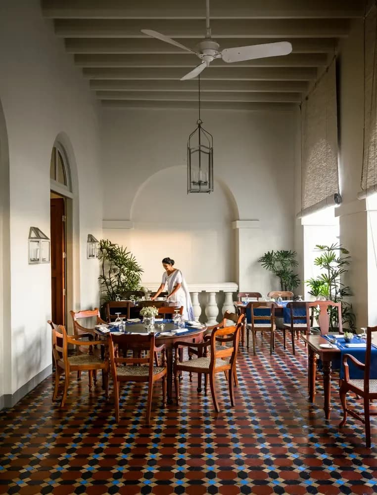 Amangalla’s colonial dining room with patterned floors and timber furniture