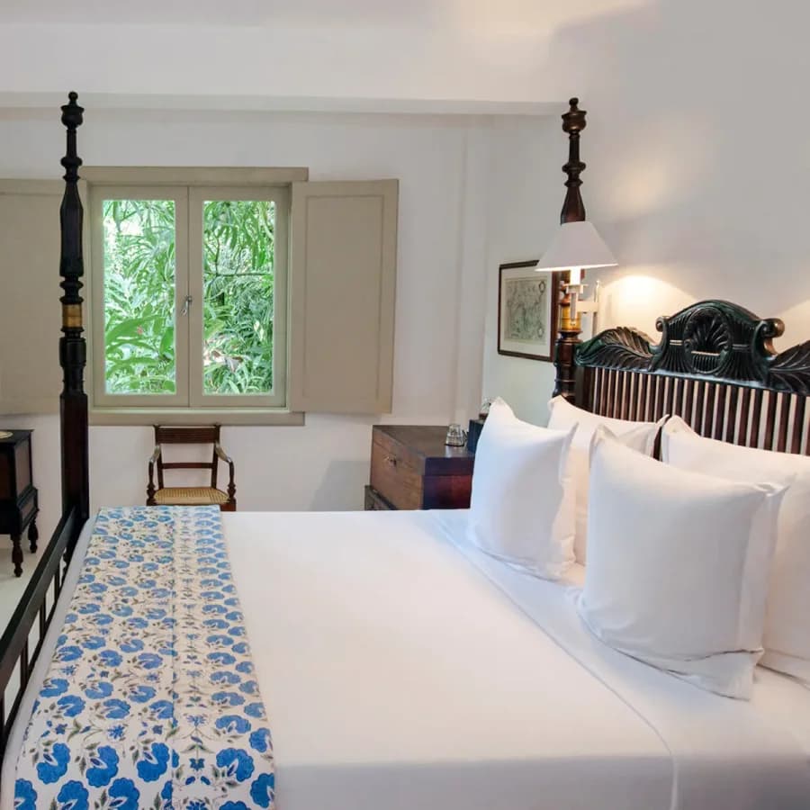 Amangalla Garden House bedroom overlooking leafy gardens