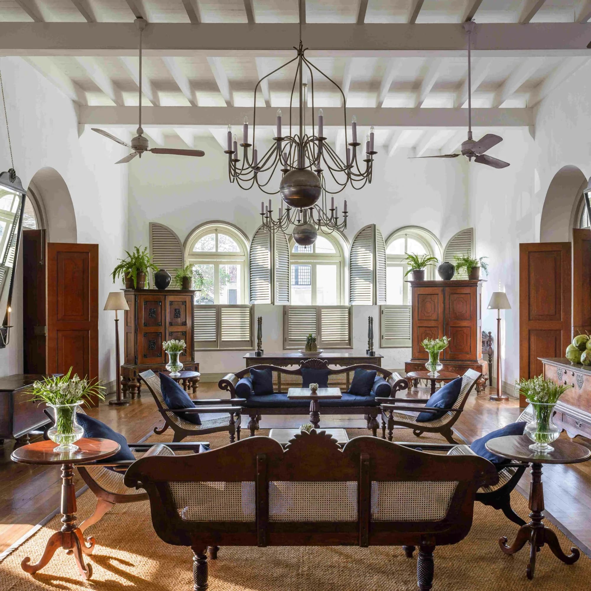 Amangalla’s elegant lounge with high ceilings, a chandelier and period furniture