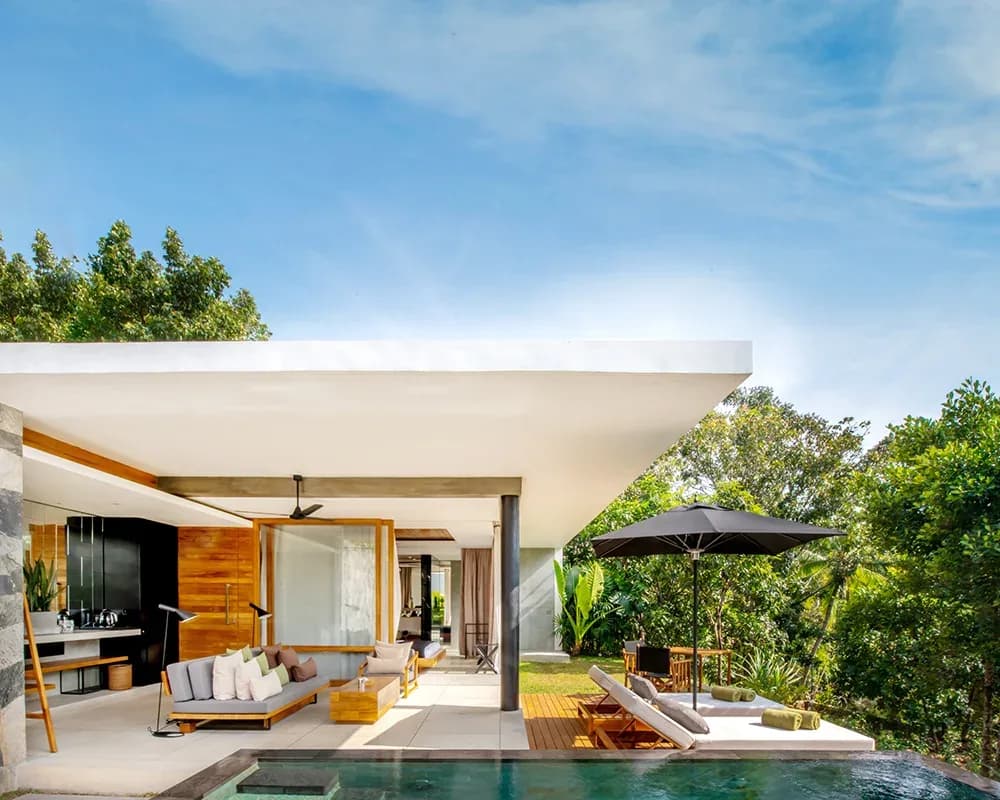 Contemporary villa with a private plunge pool, terrace and open living space at Haritha