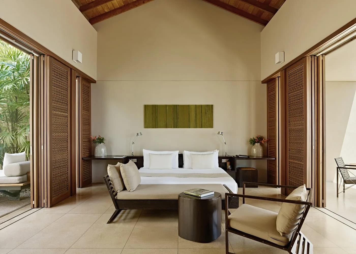 Amanwella suite with a timber ceiling, open shutters and a private terrace